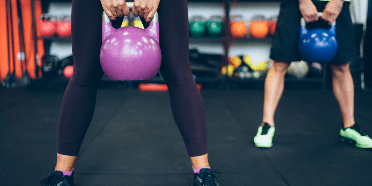 Two people lifting weight.