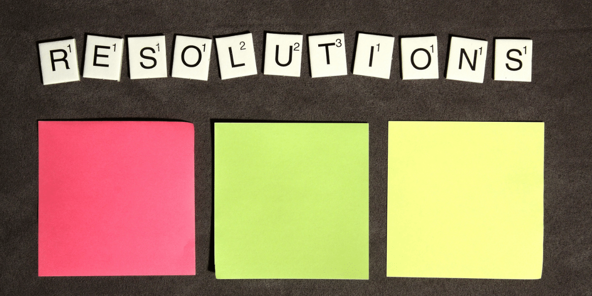 “Resolutions” with colorful sticky notes for planning goals.