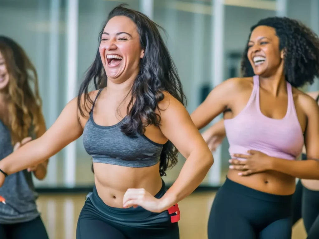 Group of women smiling while dancing.